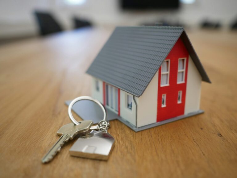 Model house and keys on a table