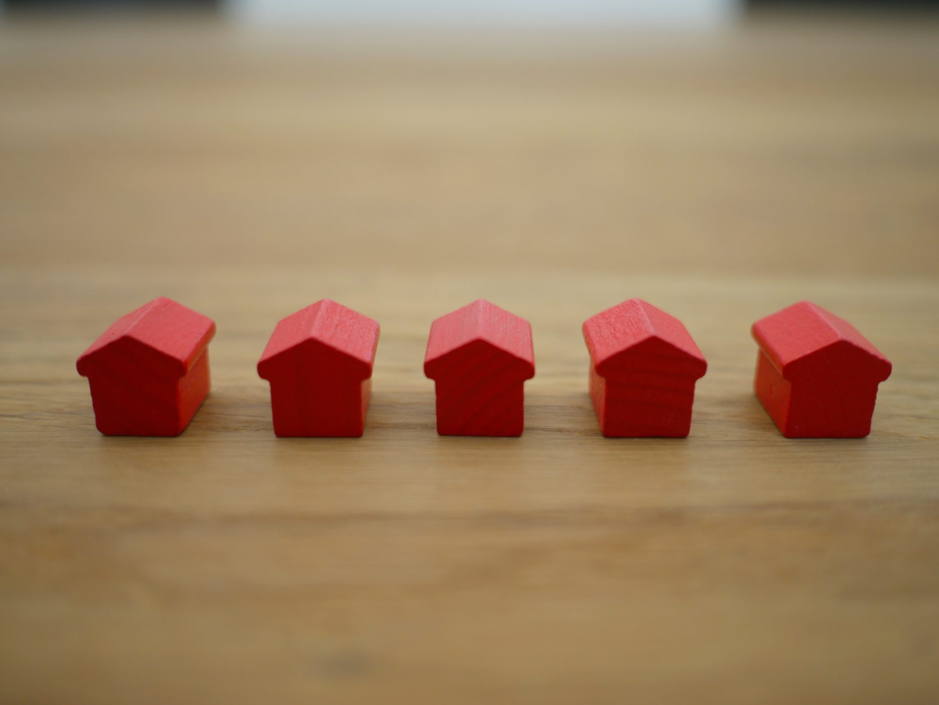 Row of small red model houses