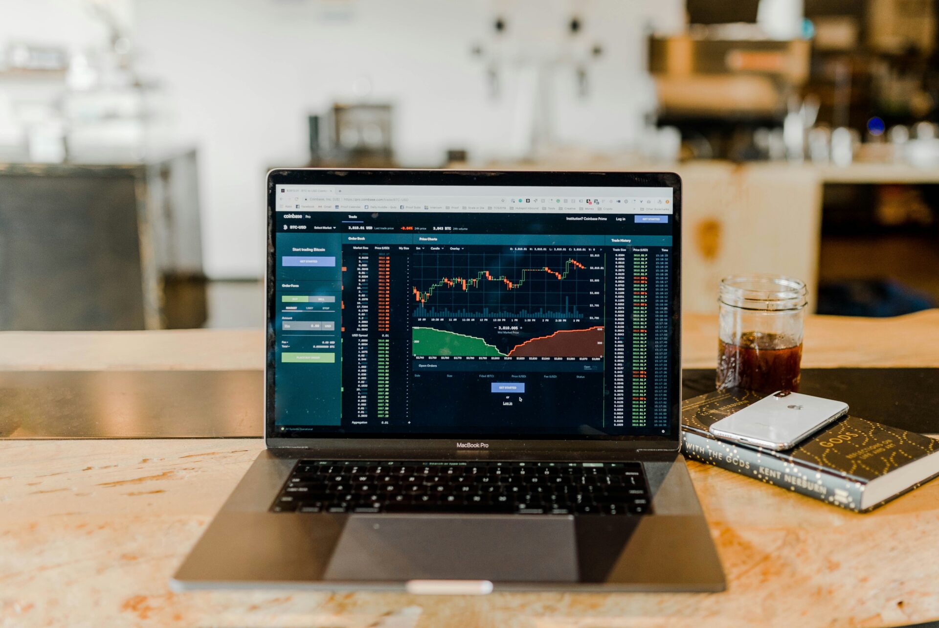 Laptop showing financial market charts